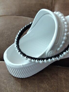 Embellished fake pearl plastic white shoes for women with matching hair band.